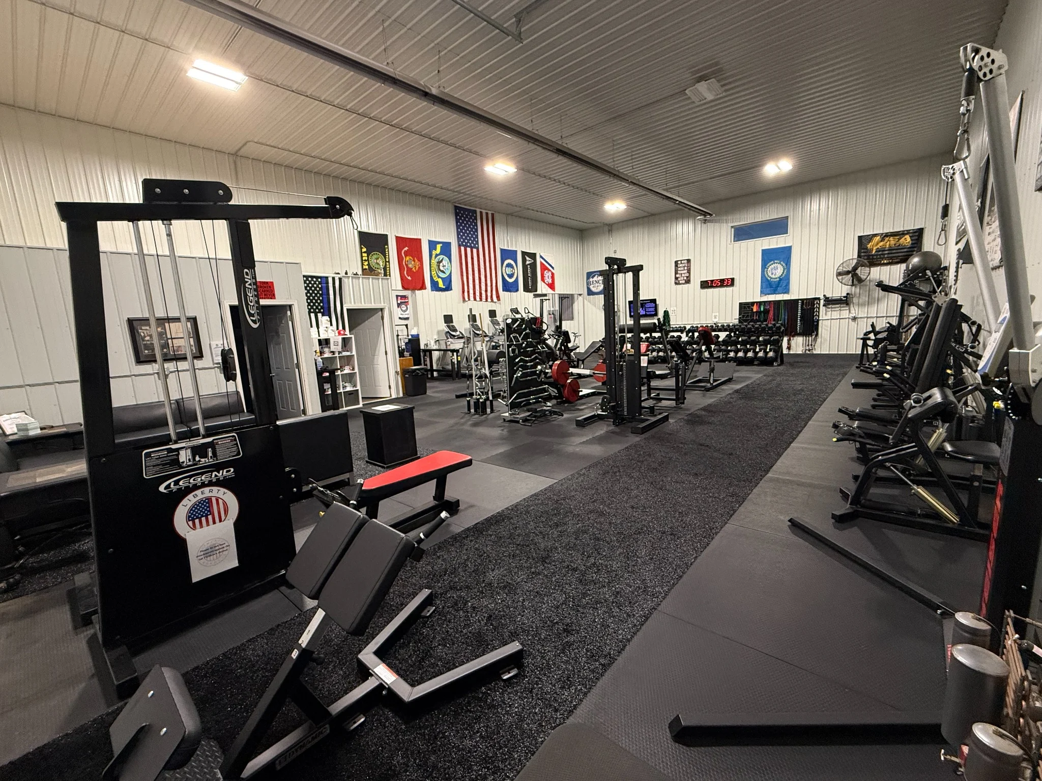 Wide-angle photograph of Liberty Barbell gym interior